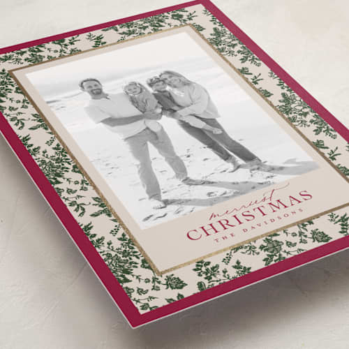 This is a holly berry foil pressed holiday cards with foil pressed by Jenna Holcomb called merry floral toile printing on recycled smooth signature in standard