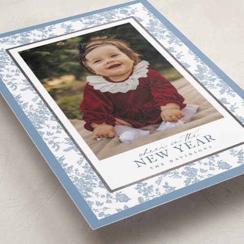 This is a powder foil pressed holiday cards with foil pressed by Jenna Holcomb called merry floral toile printing on recycled smooth signature in standard