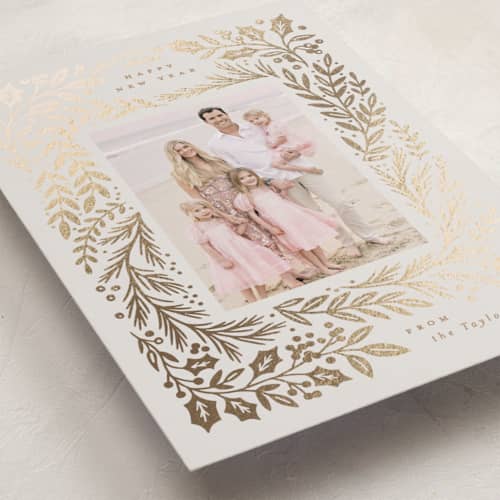 This is a buttercream foil pressed holiday cards with foil pressed by Alethea and Ruth called gilded forest printing on recycled smooth signature in standard
