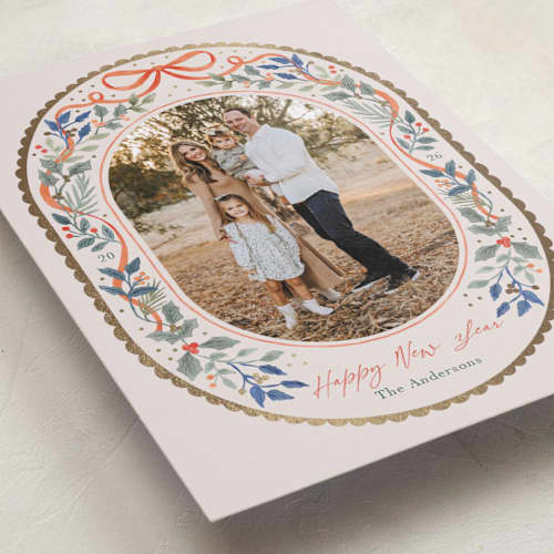 This is a holly foil pressed holiday cards with foil pressed by Elly called a gentle bow printing on recycled smooth signature in standard