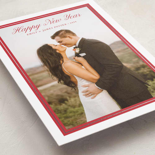 This is a ruby foil pressed holiday cards with foil pressed by Alston Foster called evermore printing on recycled smooth signature in standard