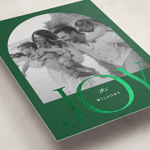 This is a pine foil pressed holiday cards with foil pressed by Brianne Larsen called joy arch printing on recycled smooth signature in standard