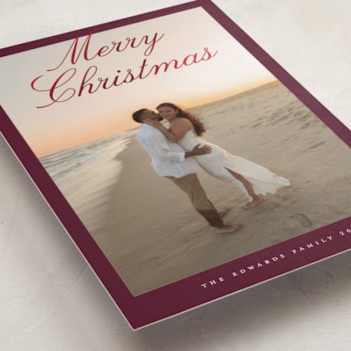 This is a cranberry foil pressed holiday cards with foil pressed by Nicole Walsh called modern script printing on recycled smooth signature in standard