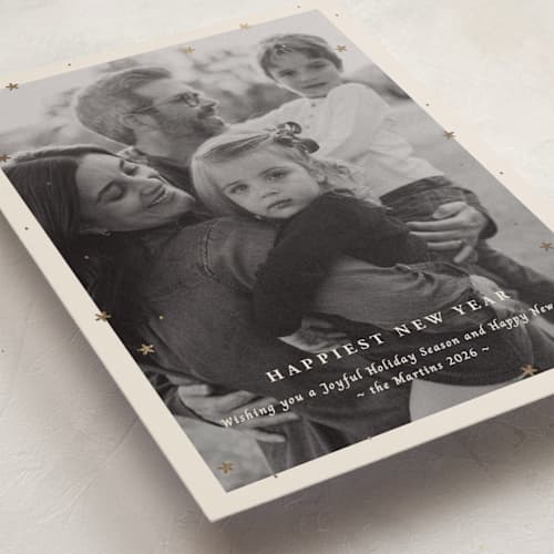 This is a champagne foil pressed holiday cards with foil pressed by Ani Somi called merry little stars printing on recycled smooth signature in standard