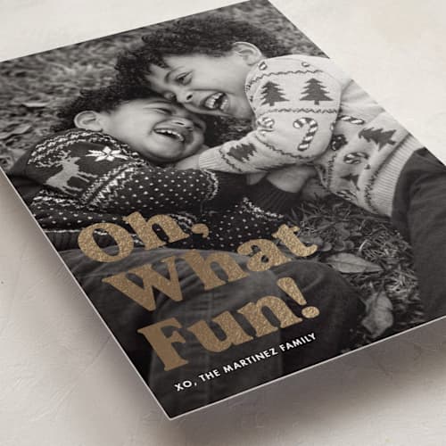 This is a cotton foil pressed holiday cards with foil pressed by Kerry Doyle called oh what fun printing on recycled smooth signature in standard