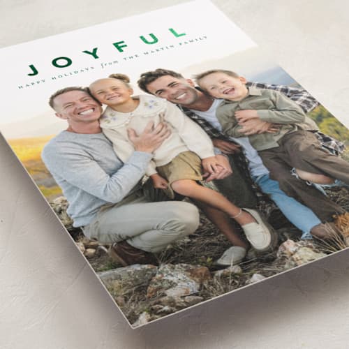 This is a wreath foil pressed holiday cards with foil pressed by Laura Hamm called a joyful family printing on recycled smooth signature in standard