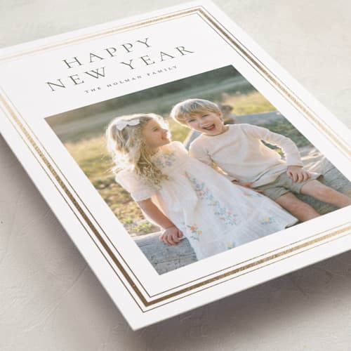 This is a pine foil pressed holiday cards with foil pressed by Wildfield Paper Co called eucalyptus printing on recycled smooth signature in standard