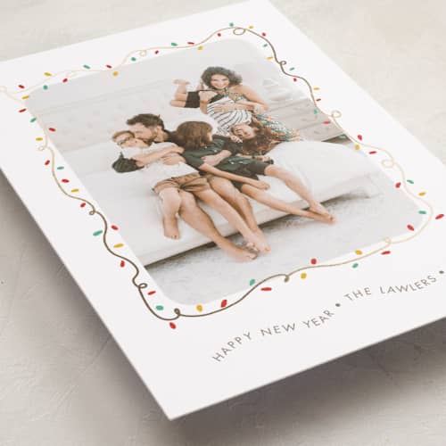 This is a frosting foil pressed holiday cards with foil pressed by Holly Whitcomb called crazy lights printing on recycled smooth signature in standard