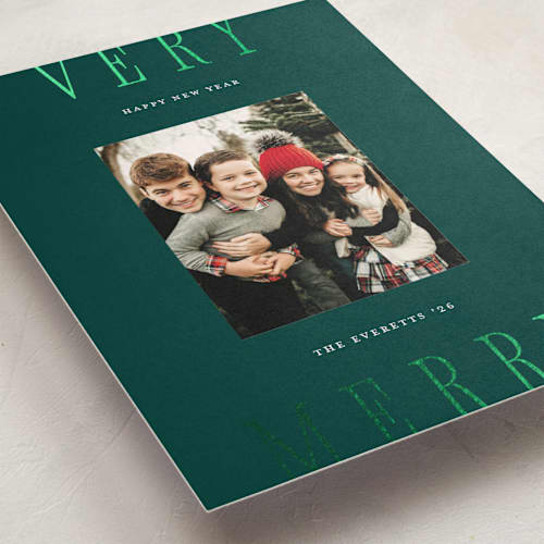 This is a wreath foil pressed holiday cards with foil pressed by Chryssi Tsoupanarias called merry type printing on recycled smooth signature in standard