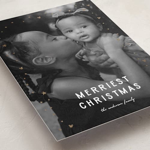 This is a snow foil pressed holiday cards with foil pressed by Ilene Guy called disney's merriest christmas printing on recycled smooth signature in standard