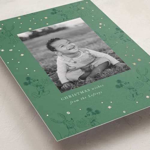 This is a fir foil pressed holiday cards with foil pressed by Corinne Malesic called disney's mickey and pluto printing on recycled smooth signature in standard