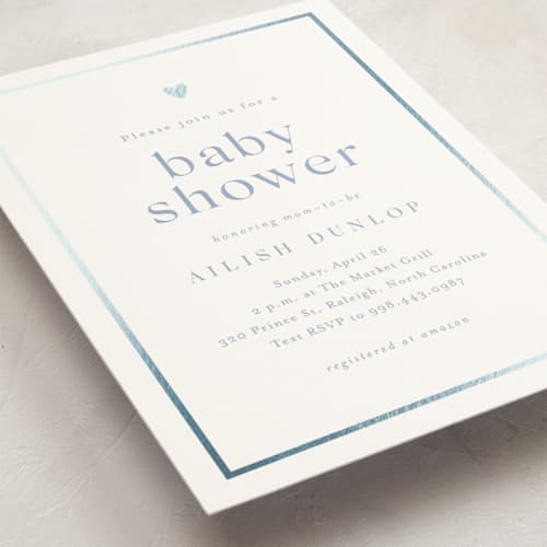 This is a provincial blue foil stamped baby shower invitations with foil pressed by Stacey Meacham called heartbeat printing on signature in standard