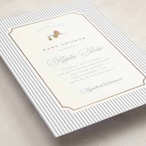 This is a dusty blue foil stamped baby shower invitations with foil pressed by Stacey Meacham called storybook stork printing on signature in standard