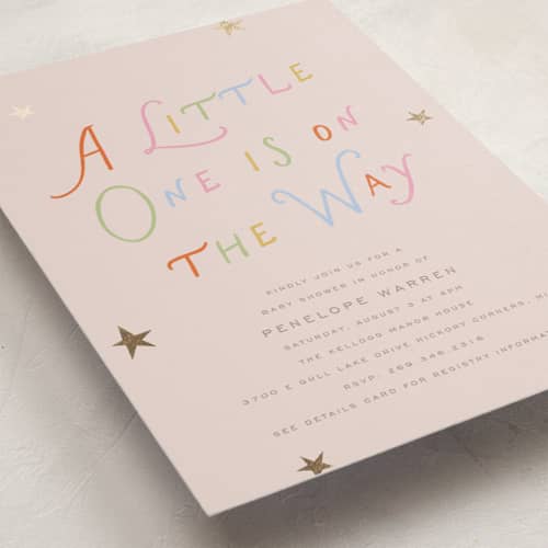 This is a blush foil stamped baby shower invitations with foil pressed by Pixel and Hank called on the way printing on signature in standard
