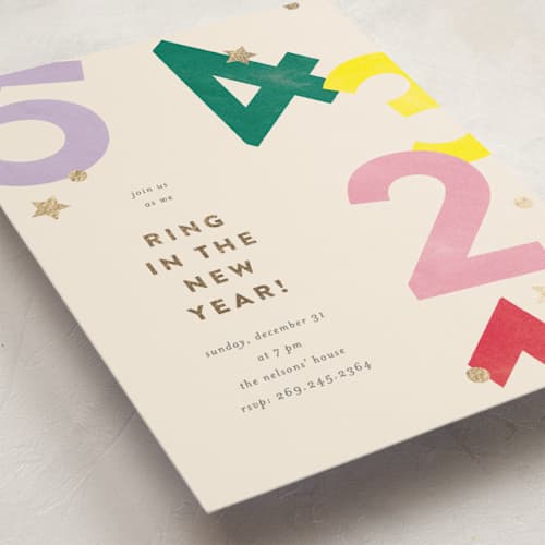 This is a punch holiday party invitations with foil pressed by Pixel and Hank called ring in the new year printing on signature in standard