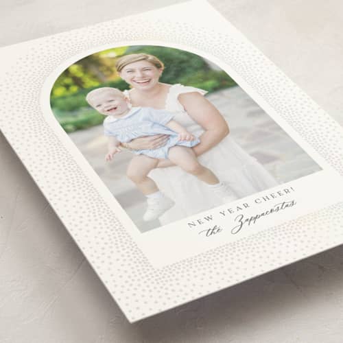 This is a snow gloss press holiday cards with gloss press by Kamala Nahas called frosted arch printing on signature in standard