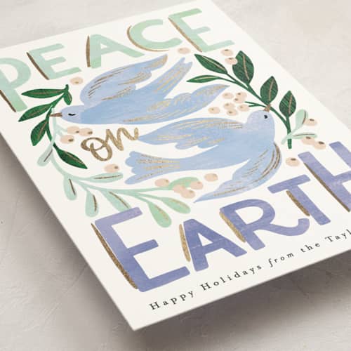 This is a periwinkle foil pressed holiday cards with foil pressed by Alethea and Ruth called peace on earth birds printing on signature in standard