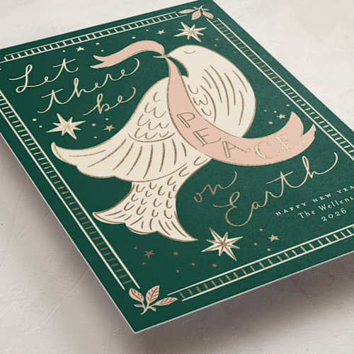 This is a evergreen foil pressed holiday cards with foil pressed by Erin German called peace on earth dove printing on signature in standard