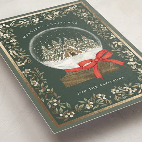 This is a forest foil pressed holiday cards with foil pressed by Jackie Crawford called cabin snow globe printing on signature in standard