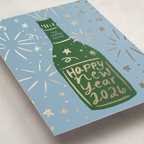 This is a marine foil pressed holiday cards with foil pressed by Inkblot Design called champagne sparkle printing on signature in standard