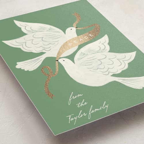 This is a sage foil pressed holiday cards with foil pressed by Alethea and Ruth called peace birds printing on signature in standard