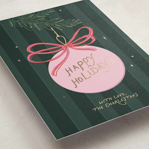 This is a pine needle foil pressed holiday cards with foil pressed by Roseberry called merry bow printing on signature in standard