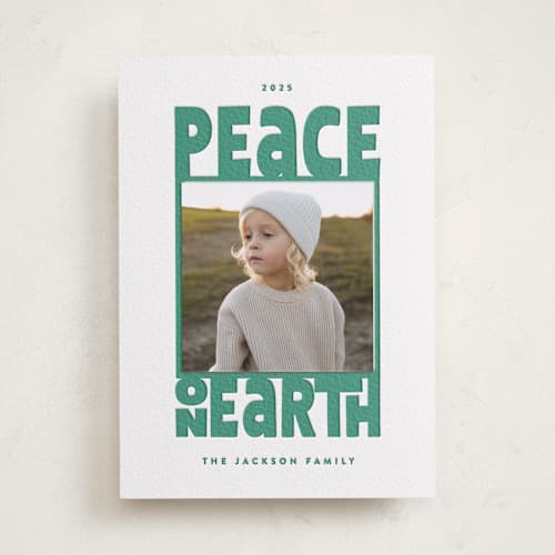 This is a evergreen photo mount holiday cards with letterpress by Leah Bisch called peace on earth printing on white cotton in photo_mount