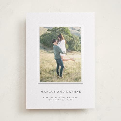 This is a soft black save the date with letterpress by Wildfield Paper Co called daisies printing on luxe white cotton in photo_mount