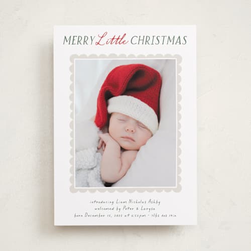 This is a holly babys first christmas with standard by Hooray Creative called merry scallop printing on recycled smooth signature in standard