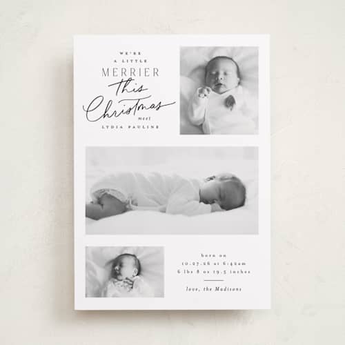 This is a snow babys first christmas with standard by Everett Paper Goods called merrier this year printing on recycled smooth signature in standard