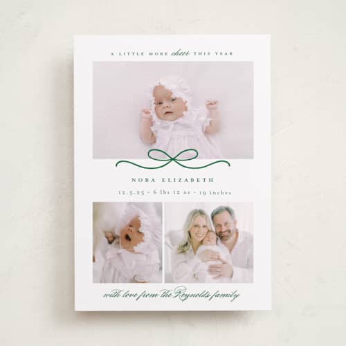 This is a pine babys first christmas with standard by Emily Betts called baby's first printing on recycled smooth signature in standard