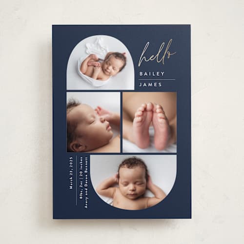 This is a navy foil stamped birth announcements with foil pressed by Carolyn MacLaren called so current printing on recycled smooth signature in standard