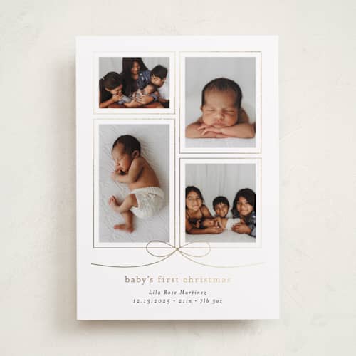 This is a ink babys first christmas with foil pressed by Blustery August called with a bow printing on recycled smooth signature in standard