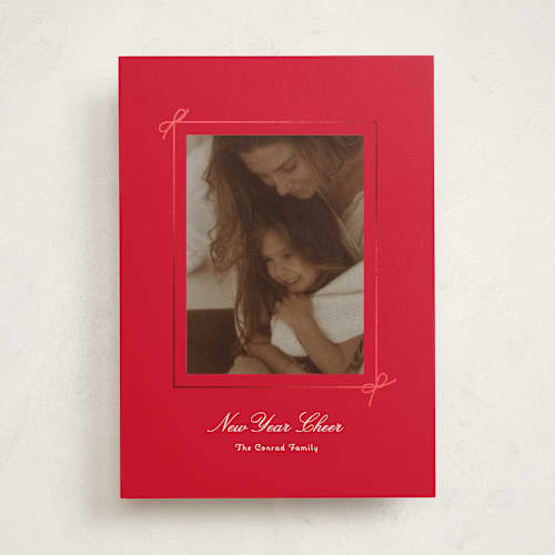 This is a poinsettia foil pressed holiday cards with foil pressed by Baumbirdy called delicate bow printing on recycled smooth signature in standard