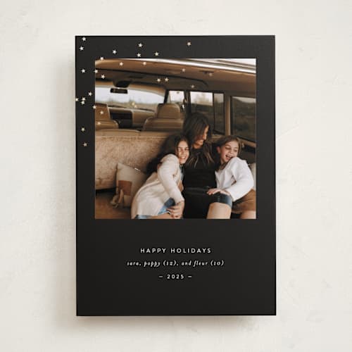 This is a ebony foil pressed holiday cards with foil pressed by Bramble Studio called starry eyed printing on recycled smooth signature in standard