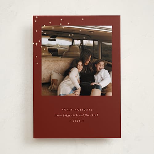 This is a cranberry foil pressed holiday cards with foil pressed by Bramble Studio called starry eyed printing on recycled smooth signature in standard