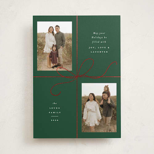 This is a holly foil pressed holiday cards with foil pressed by Emily Betts called bow two printing on recycled smooth signature in standard