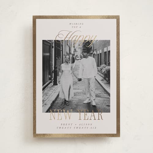 This is a cream foil pressed holiday cards with foil pressed by Megan Cash called scripted frame printing on recycled smooth signature in standard