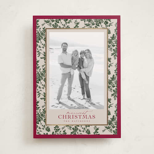 This is a holly berry foil pressed holiday cards with foil pressed by Jenna Holcomb called merry floral toile printing on recycled smooth signature in standard
