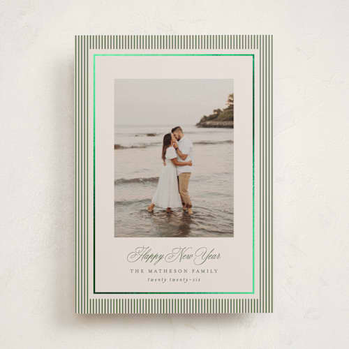This is a cedar foil pressed holiday cards with foil pressed by Kelly Schmidt called striped elegance printing on recycled smooth signature in standard