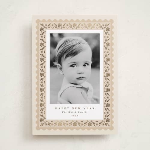 This is a eggnog foil pressed holiday cards with foil pressed by Olivia Raufman called folkloric printing on recycled smooth signature in standard