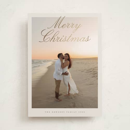 This is a sand foil pressed holiday cards with foil pressed by Nicole Walsh called modern script printing on recycled smooth signature in standard