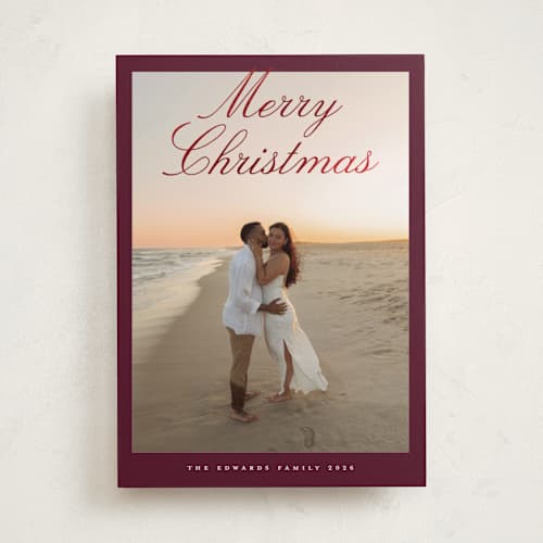 This is a cranberry foil pressed holiday cards with foil pressed by Nicole Walsh called modern script printing on recycled smooth signature in standard