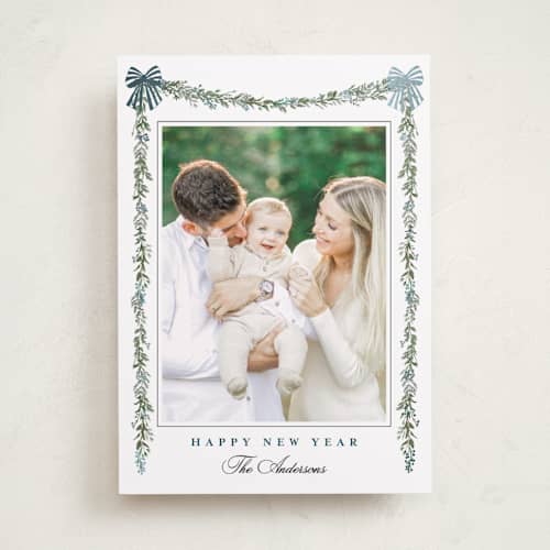 This is a winter berry foil pressed holiday cards with foil pressed by Susan Moyal called holly & bows printing on recycled smooth signature in standard