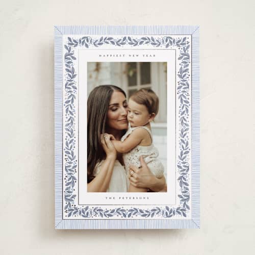 This is a frost foil pressed holiday cards with foil pressed by Jenna Holcomb called antique greenery printing on recycled smooth signature in standard