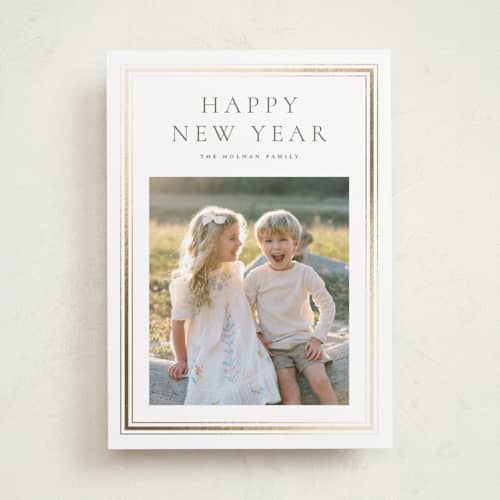 This is a pine foil pressed holiday cards with foil pressed by Wildfield Paper Co called eucalyptus printing on recycled smooth signature in standard