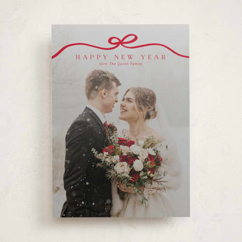 This is a cardinal holiday photo cards with standard by Kaydi Bishop called bow tied printing on recycled smooth signature in standard