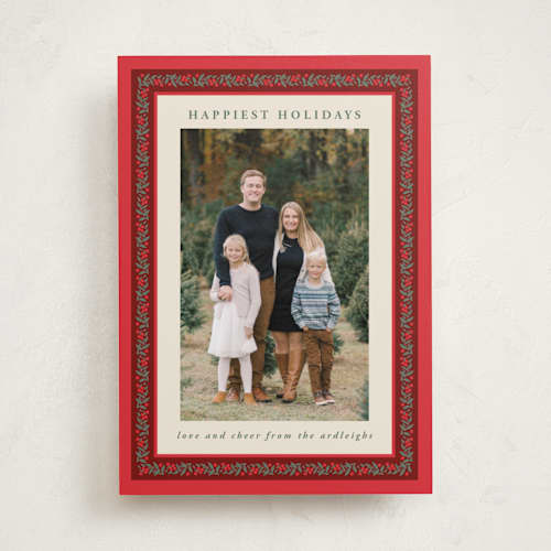 This is a holly berry holiday photo cards with standard by Kristie Kern called revelry printing on recycled smooth signature in standard