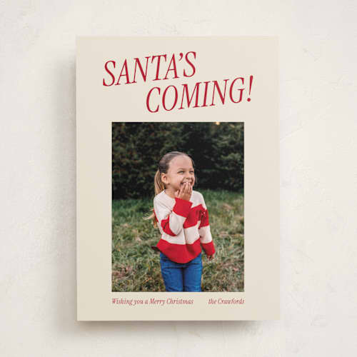 This is a candy cane holiday photo cards with standard by Angela Garrick called santa's coming printing on recycled smooth signature in standard