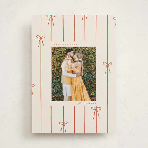 This is a cider holiday photo cards with standard by Ellen Schlegelmilch called lines of bows printing on recycled smooth signature in standard